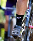 black cycling socks with white logo