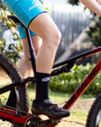 black cycling socks on mountain bike